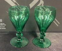 A pair of Antique green glass drinking glasses wit