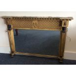 A good gilt over mantle mirror of fluted design. E