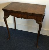 A Continental walnut hinged top card table on four