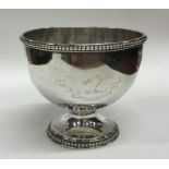 A heavy Georgian silver bowl with beaded rim. Lond