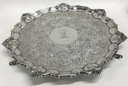 A good chased silver salver with central armorial.