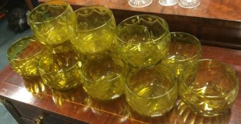 A set of twelve yellow glass dessert dishes with s