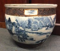 A large Chinese crackleware fish bowl decorated in