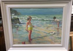 A framed oil on board depicting children feeding s