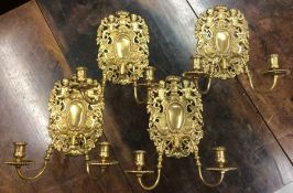 A rare set of four silver gilt candle wall lights