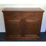 An Edwardian mahogany two drawer and two door side