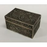 A heavy Chinese silver box with panelled decoratio
