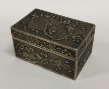 A heavy Chinese silver box with panelled decoratio