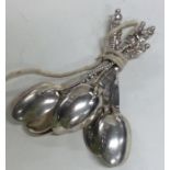 A set of six silver Apostle top coffee spoons. App