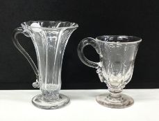 A Georgian glass drinking vessel with handle to pe
