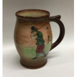 A Royal Doulton mug decorated with golfers in reli