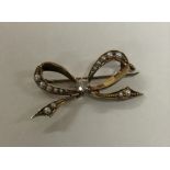 A small 15 carat gold diamond and pearl brooch. Ap