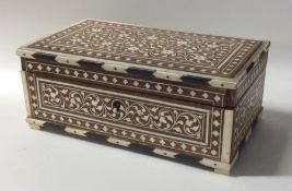 A rectangular Anglo-Indian hinged top box with ivo