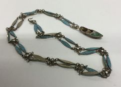 A Russian silver and enamelled necklace decorated