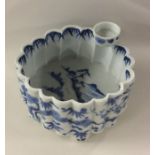 A Chinese blue and white shaped bowl decorated wit