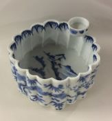 A Chinese blue and white shaped bowl decorated wit