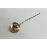A 14 carat gold diamond stick pin. Approx. 5 grams