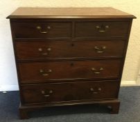 A Georgian mahogany chest of three long and two sh