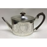 A good George III oval bright cut silver teapot wi