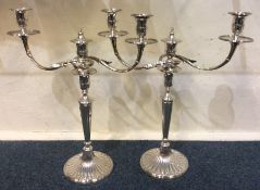 A fine pair of Georgian candelabra on tapering flu