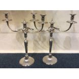 A fine pair of Georgian candelabra on tapering flu