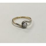 A good diamond single stone twist ring in 18 carat