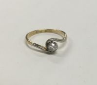 A good diamond single stone twist ring in 18 carat
