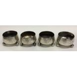 A heavy set of four Victorian silver salts on ball