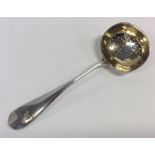A good Russian silver tea strainer with gilt bowl.