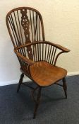 A large yew wood stick back Windsor chair of typic