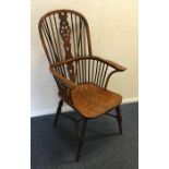 A large yew wood stick back Windsor chair of typic