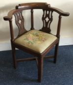 A Georgian oak corner chair. Est. £30 - £50.