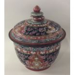 A Chinese tapering bowl and cover decorated in bri