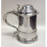 A good quality George II silver lidded tankard on