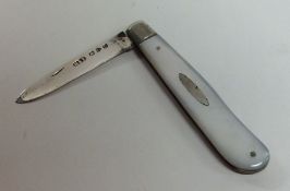 A silver and MOP fruit knife with hinged decoratio