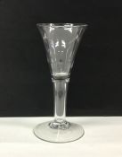 A Georgian tapering drinking glass on hollow plain