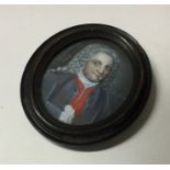 An Antique oval painted framed ivory miniature of