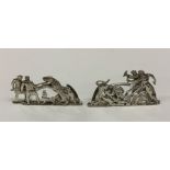 A good pair of silver menu holders decorated with
