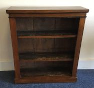 A mahogany bookcase with moulded top. Est. £30 - £