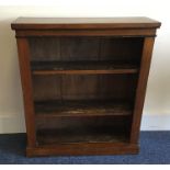 A mahogany bookcase with moulded top. Est. £30 - £