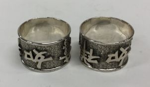 A pair of Chinese silver napkin rings. Punched to