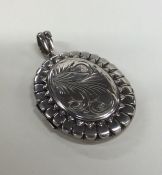 An oval Victorian silver locket. Approx. 23 grams.