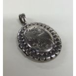 An oval Victorian silver locket. Approx. 23 grams.