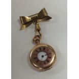 A lady's miniature Half Hunter fob watch on gilt b