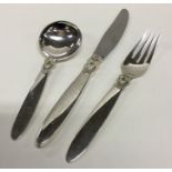 GEORG JENSEN: A good three place cutlery setting o