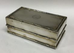 A silver mounted hinged top jewellery box with lea