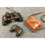 A pair of old binoculars etc. Est. £20 - £30.