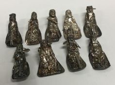 A group of nine miniature silver figures. Approx.