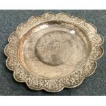 A Continental silver dish embossed with flowers. A