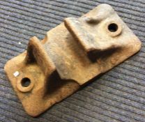 A heavy GWR cast iron track clip. Est. £15 - £20.